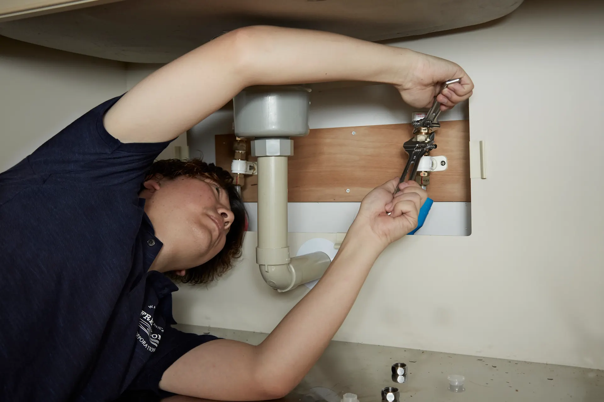 Plumber fixing a sink