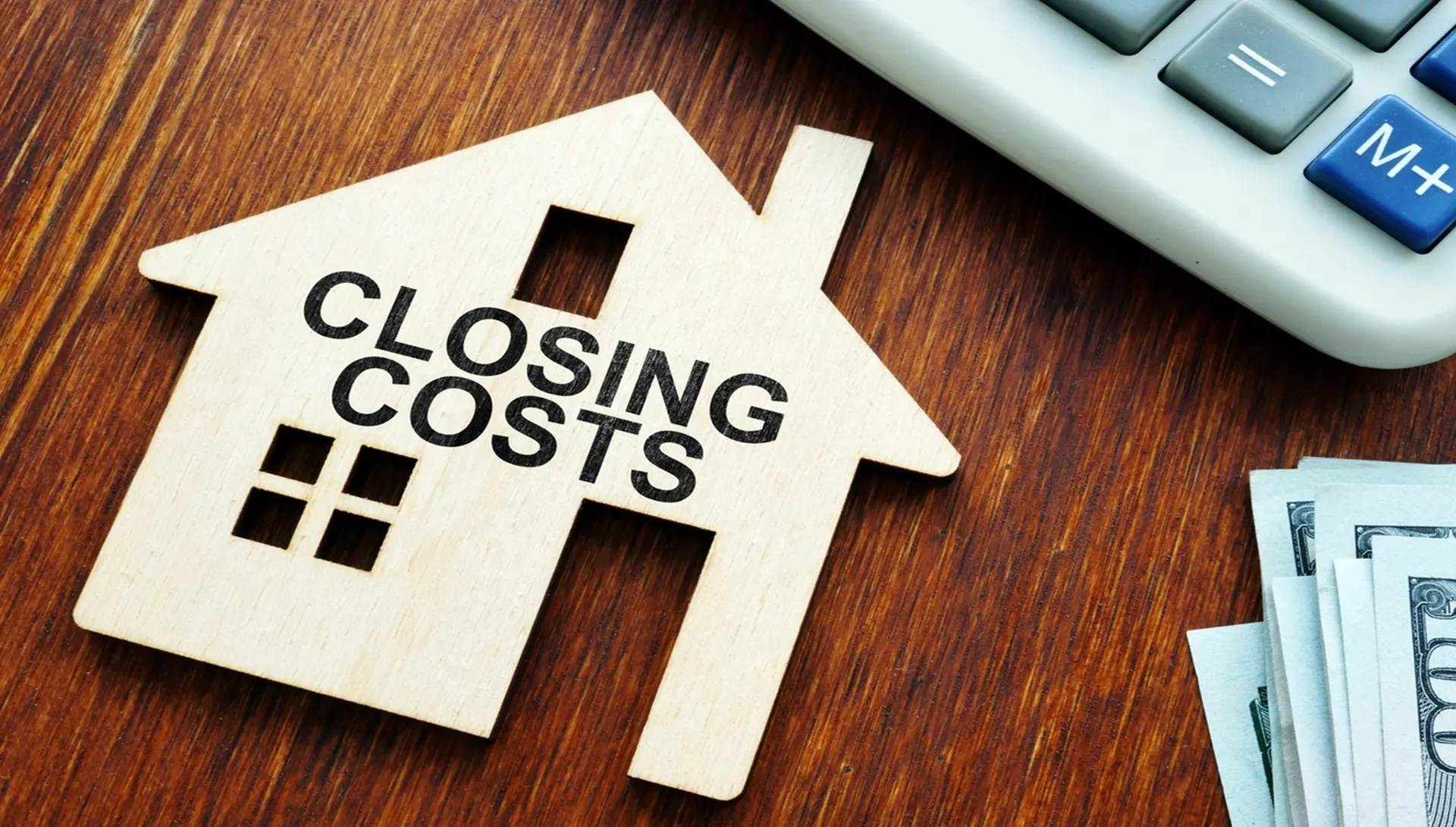Closing costs — house cutout with cash
